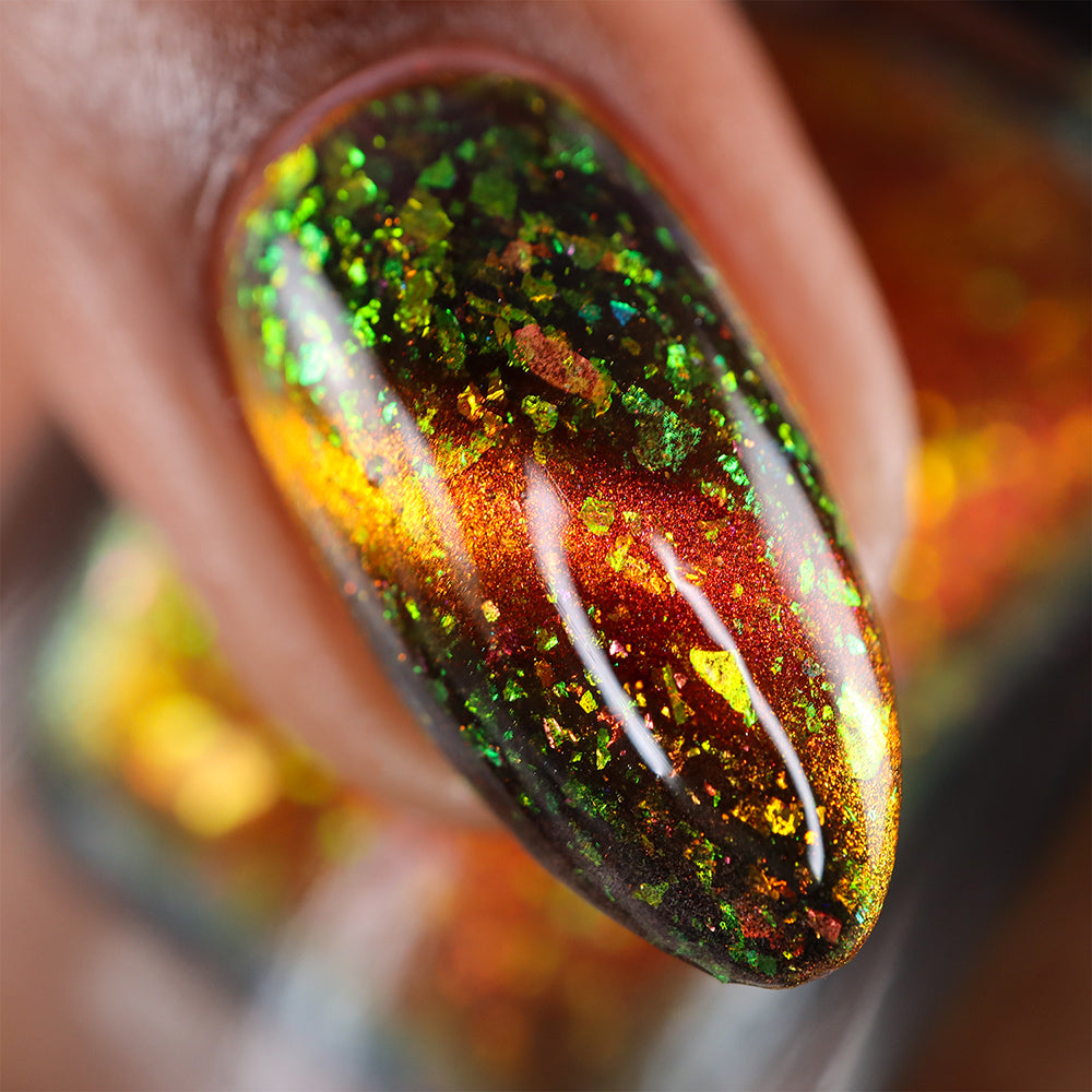 Green Flame - A black and orange magnetic nail polish with flakes
