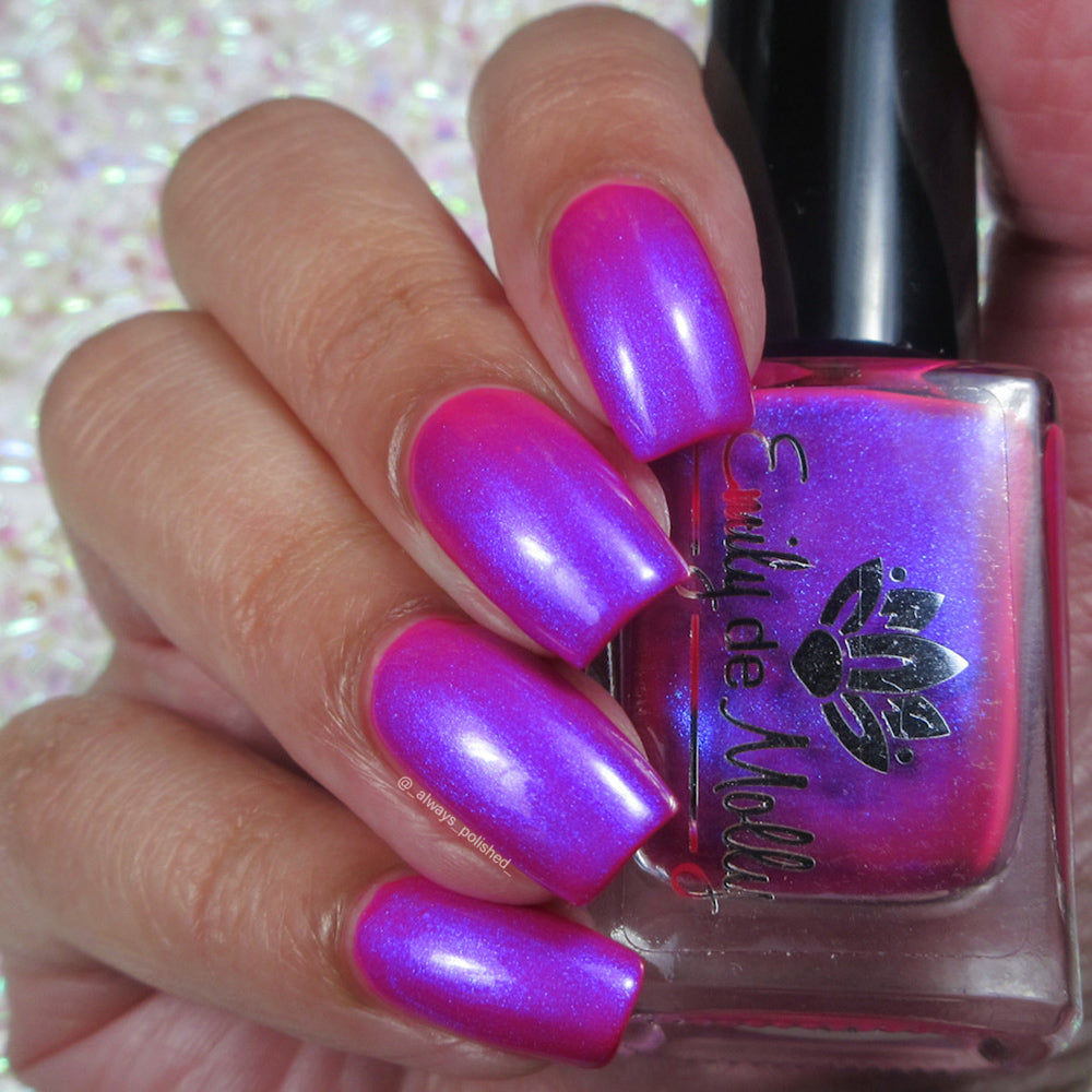 Done It Again - A bright neon pink nail polish with blue