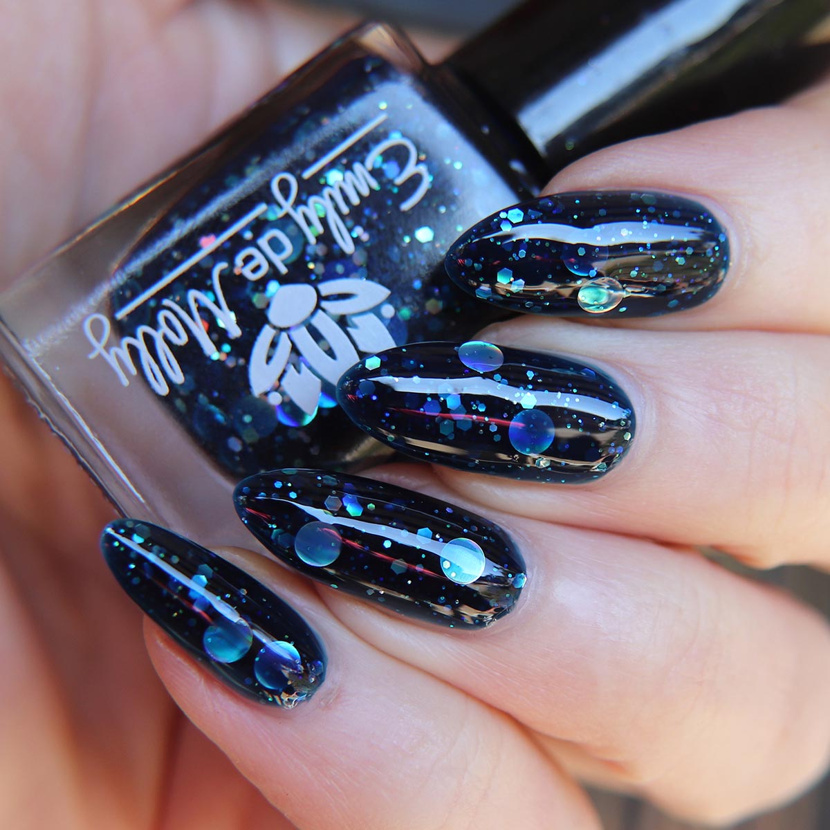 milly nailさま Mystic Forces - A deep navy jelly nail polish filled with silver