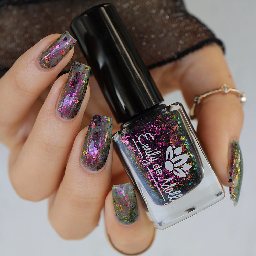 Sheer Tint Druzy - A navy jelly nail polish with iridescent flakes