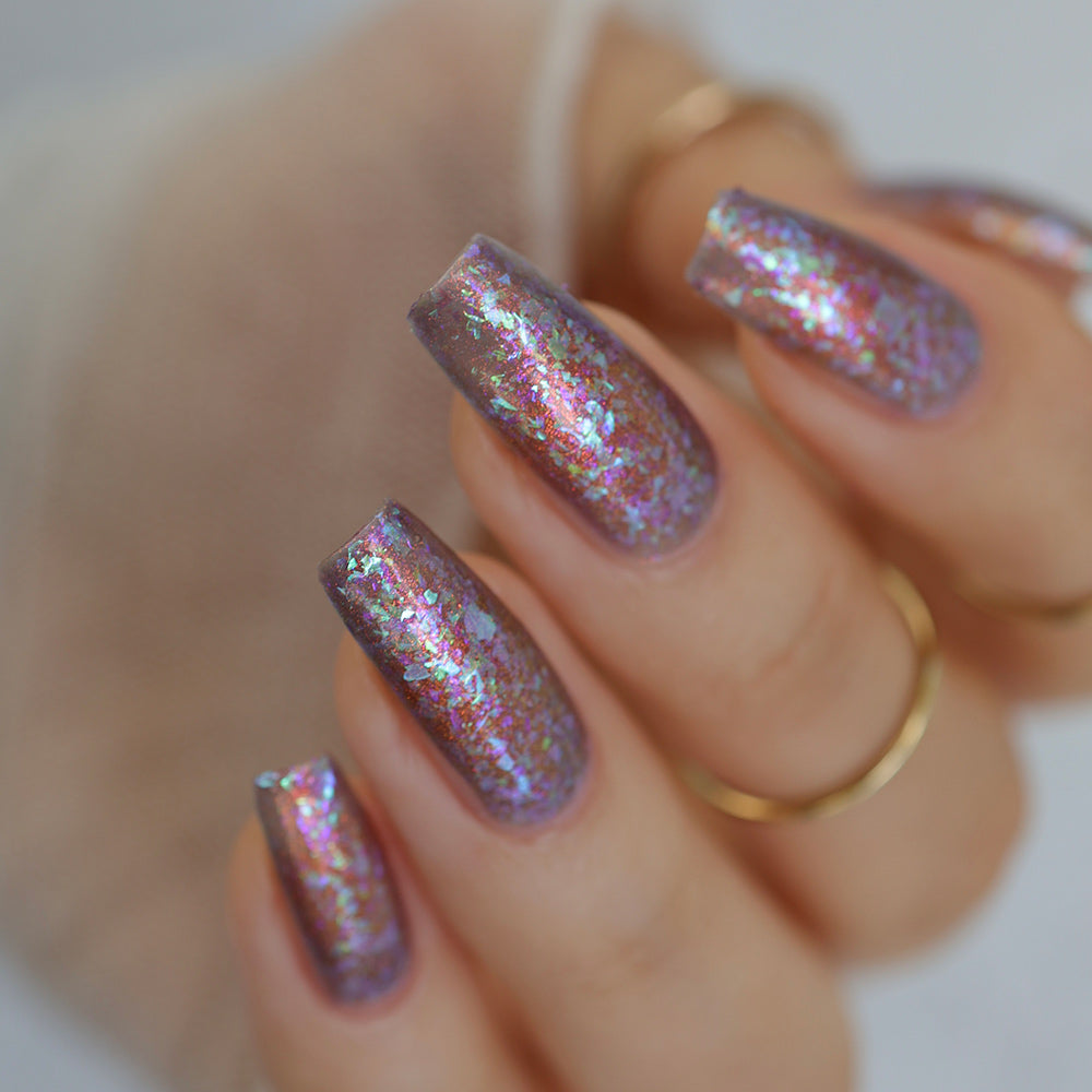 Turn Around - A dusty purple base with shimmer and flakes