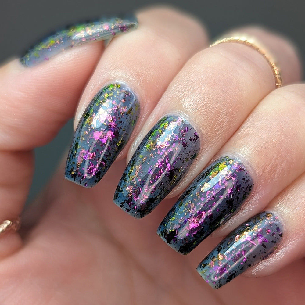 Sheer Tint Druzy - A navy jelly nail polish with iridescent flakes