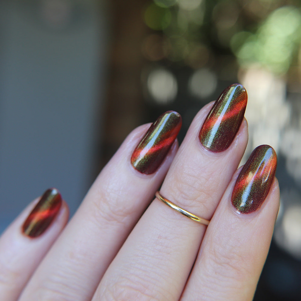 Verdant Vortex - An orange magnetic nail polish with shimmer