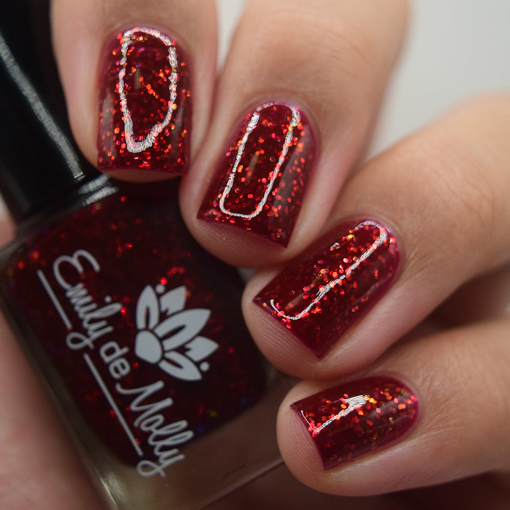 LE 386 - A deep red nail polish with iridescent glitters